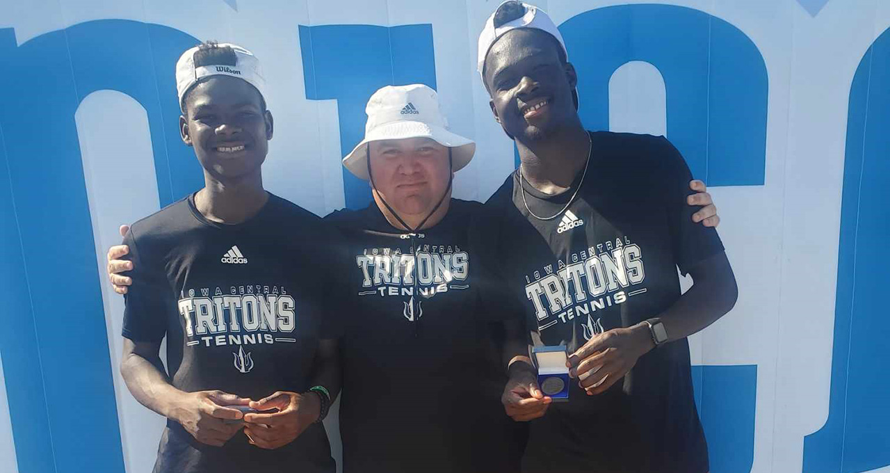 Amen Prince and Hod’Abalo Isak Padio and Coach Kenneth Michaud with their NJCAA National Championship Medals. They won the first ever in program history. 