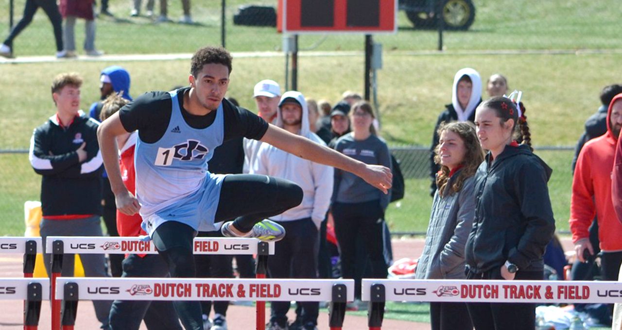 Male Track Athlete Doing Hurdles